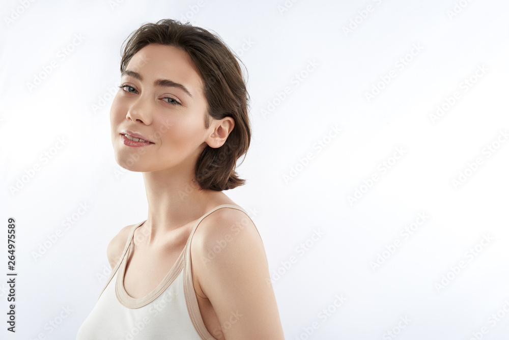 Pretty smiling sensual brunette female on white Pretty smiling sensual brunette female on white
