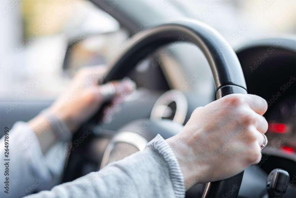 Close up of hands on steering wheel shallow dof Close up of hands on steering wheel shallow dof