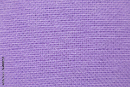 Violet natural linen fabric. Close up macro. The interlacing of threads is visible