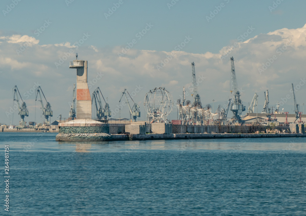 thessaloniki / Greece 11 April 2019 :  the port and the industrial area of the city ,beautiful thermaik gulf in sunny day with clouds ,they are working all day for the right fuction of the marina 
