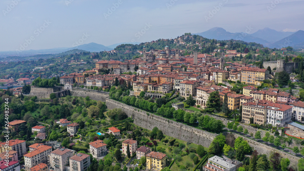 Fototapeta premium Aerial drone photo of iconic and beautiful old fortified upper Medieval city of Bergamo, Lombardy, Italy