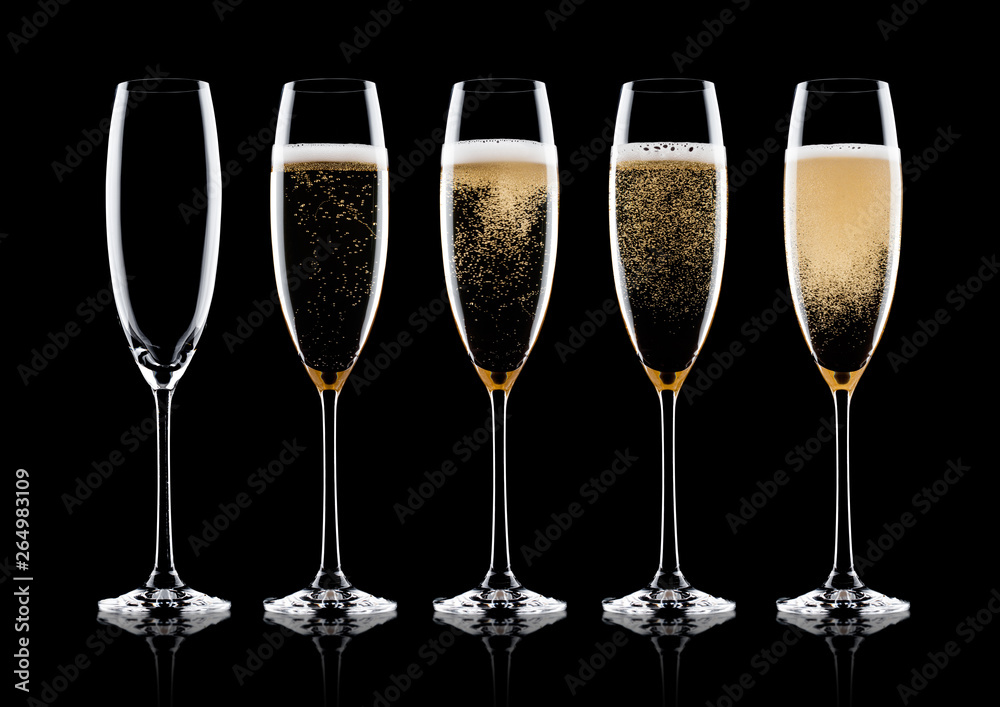 Elegant glasses of yellow champagne with bubbles Elegant glasses of yellow champagne with bubbles