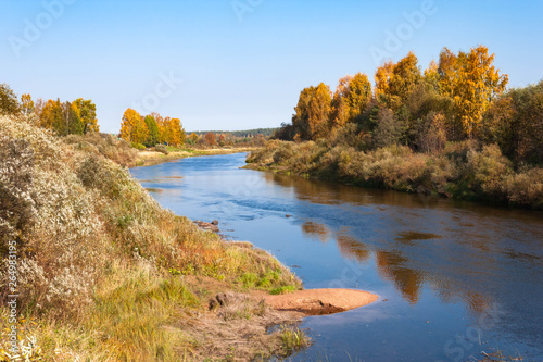 Autumn blue sky bend in the river with sandy bank in Vologodskaya oblast, Russia