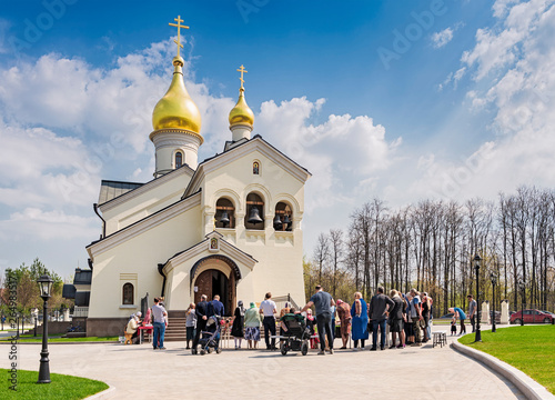 Moscow. April 27, 2019. Easter. The temple in honor of the Kazan Icon of the Mother of God in the park Meschersky. People are waiting for the consecration of Easter cakes and eggs. photo