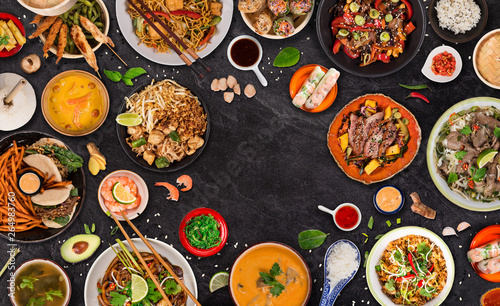 Asian food background with various ingredients on rustic stone background , top view.