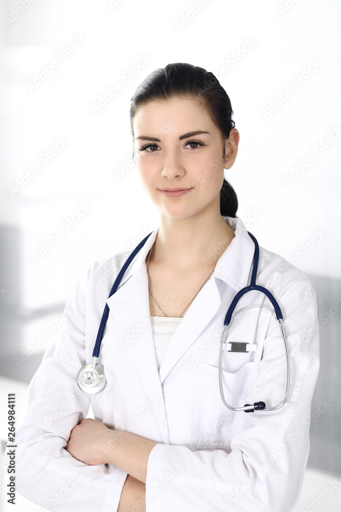 Doctor woman cheerful smiling at camera. Perfect medical service in clinic. Happy future in medicine and healthcare Doctor woman cheerful smiling at camera. Perfect medical service in clinic. Happy future in medicine and healthcare