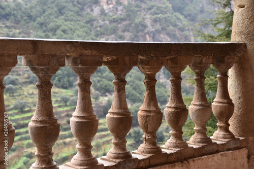 Foreground Stone Railing with Background Hill Terraces, Lebanon photo