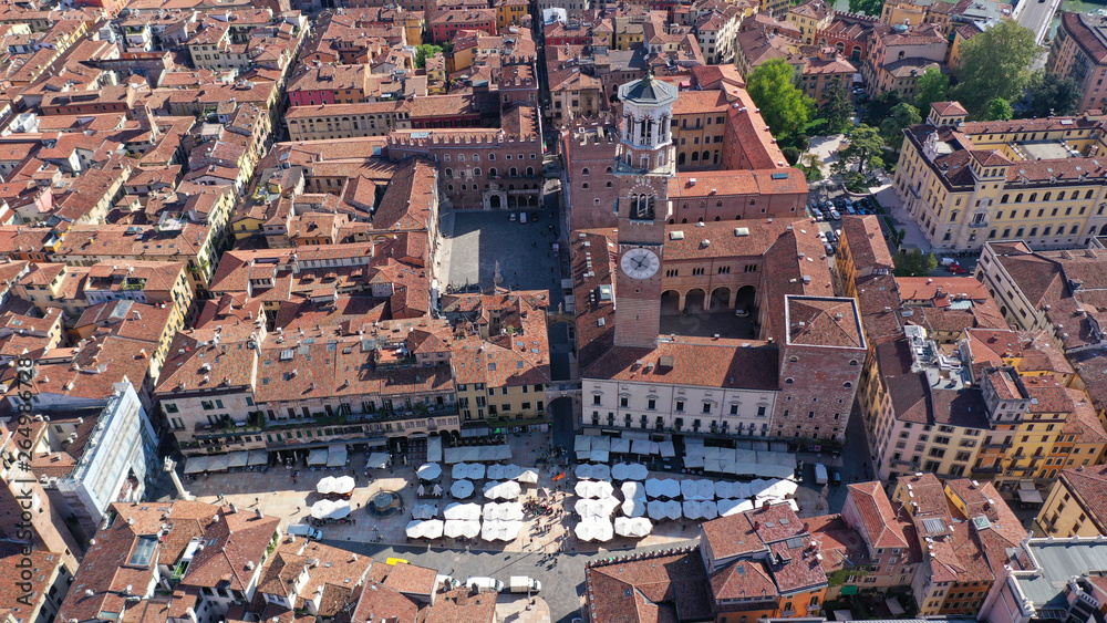 Aerial drone photo of iconic Erbe square or piazza Erbe featuring Lamberti Tower in the heart of Verona, Lombardy, Italy Aerial drone photo of iconic Erbe square or piazza Erbe featuring Lamberti Tower in the heart of Verona, Lombardy, Italy