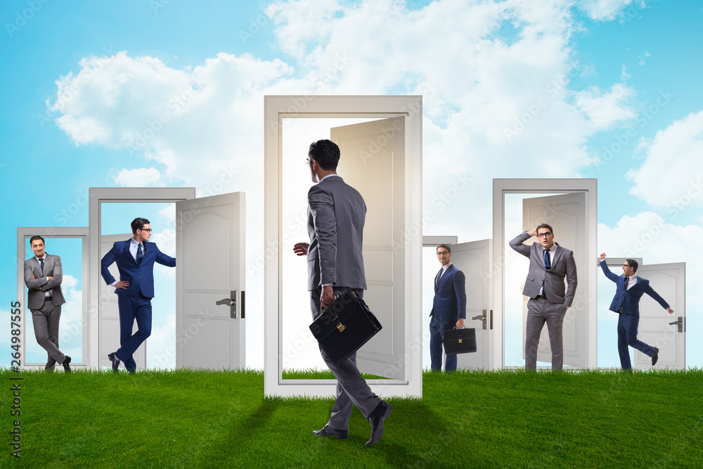 Fototapeta premium Businessman in uncertainty concept with many doors