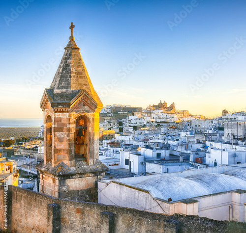 View of old town white town Ostuni and cathedral at sunrise.