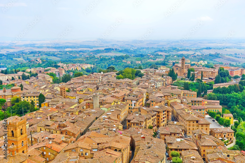 View of the historic cityscape of Siena in Tuscany, Italy.