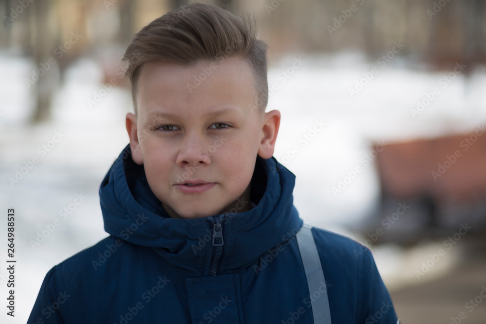 Portrait of a child on a city street. Portrait of a child on a city street.