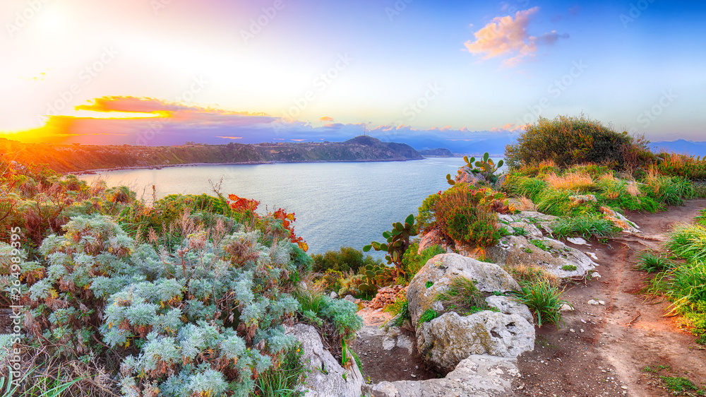 Dramatic spring sunset on the the cape Milazzo panorama of nature reserve Piscina di Venere. - obrazy, fototapety, plakaty 