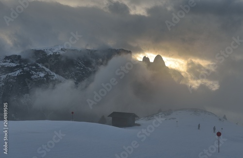 Italian Alpe di Siusi, sunset during clouds. Dolomiten Alps.