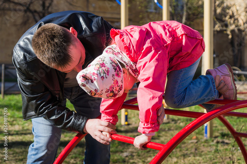 Father helps daughter to overcome the stairs