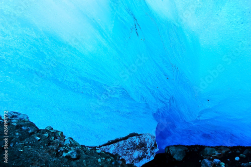 View from the beautiful ice cave under the glacier at the Vatnajokull National Park in Iceland in winter.