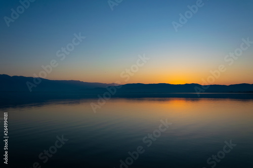 View of the lake and mountains on a sunny spring day. © PhotoRK