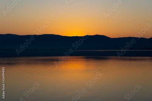 View of the lake and mountains on a sunny spring day. © PhotoRK