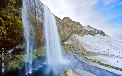 View of Seljalandsfoss waterfall in the morning in winter in Iceland.