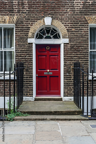 Little red door on a classic London terrace house.