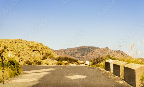 Empty and narrow road in the mountains leading from the famous tourist place Battery Castilitos © Q77photo