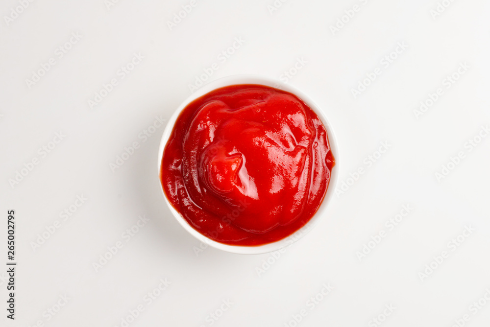 Ketchup in white plate on white background. Ketchup in white plate on white background.