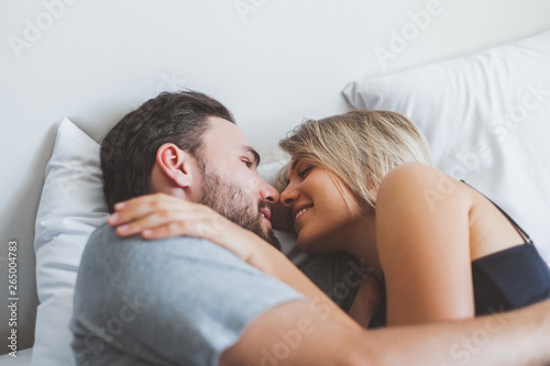 Happy couple lover on bed, hug and kiss in romantic time, love and passionate concept.