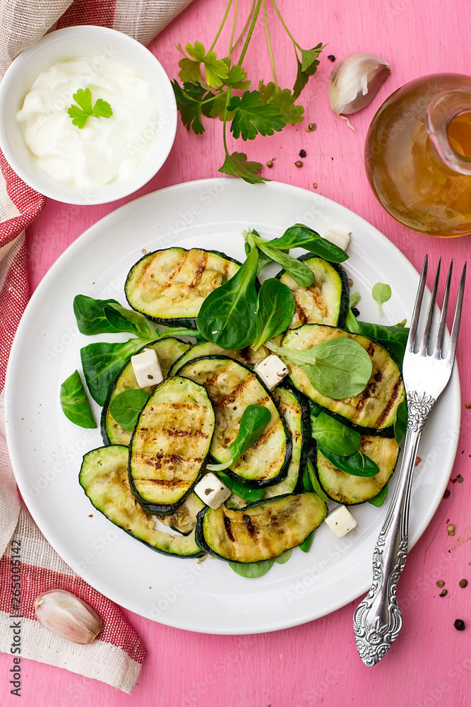 Grilled zucchini courgette with feta cheese and garlic Grilled zucchini courgette with feta cheese and garlic