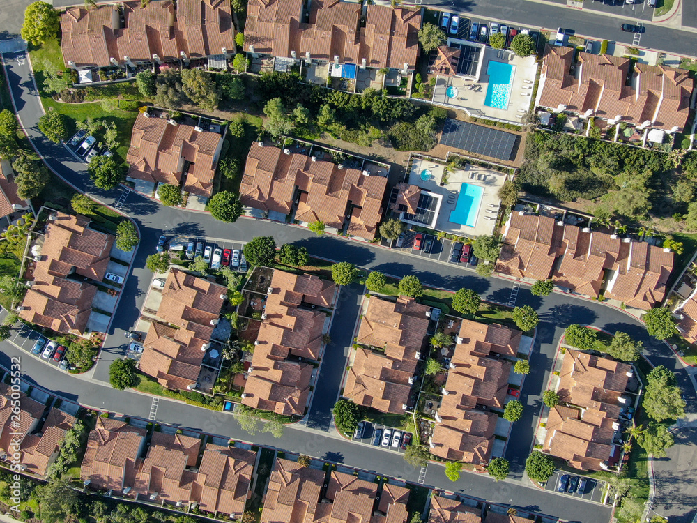 Aerial view suburban neighborhood with identical villas next to each ...