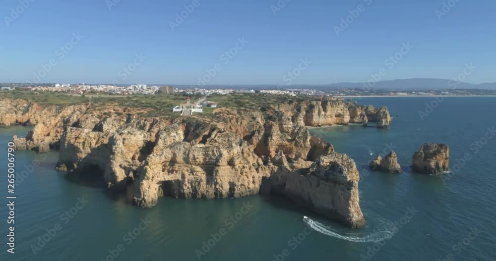 Aerial scenic seascape, of Ponta da Piedade promontory (cliff formations along coastline of Lagos city), natural landmark destination, Algarve. South Portugal. Aerial scenic seascape, of Ponta da Piedade promontory (cliff formations along coastline of Lagos city), natural landmark destination, Algarve. South Portugal.