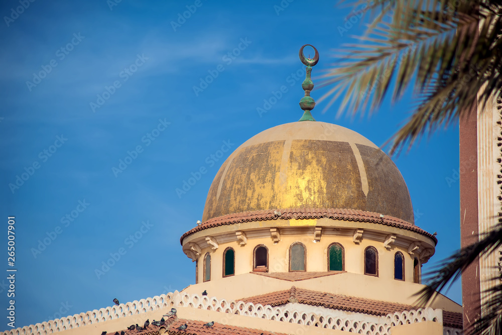 Beautiful white mosque in the sunlight and sky background