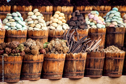 Bags of colorful herbs and spices in the market of Egypt photo