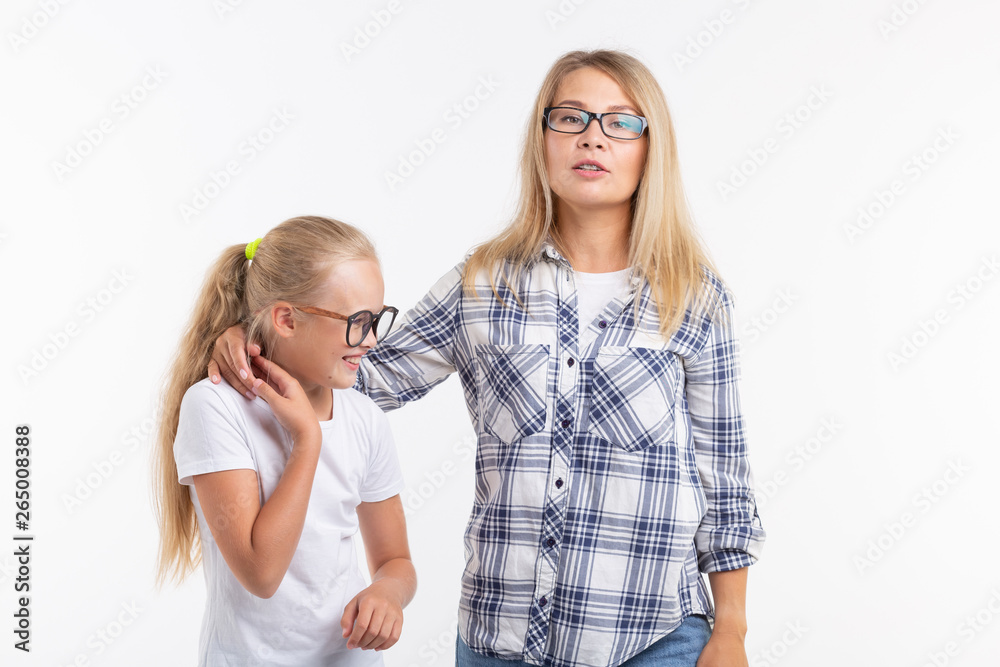 Portrait of mother and daughter with eyeglasses on white background Portrait of mother and daughter with eyeglasses on white background