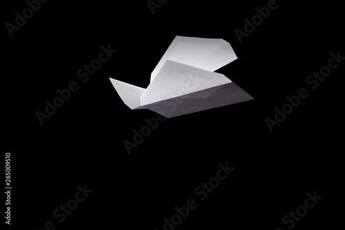 white envelope tied with a rope, falls on a black background