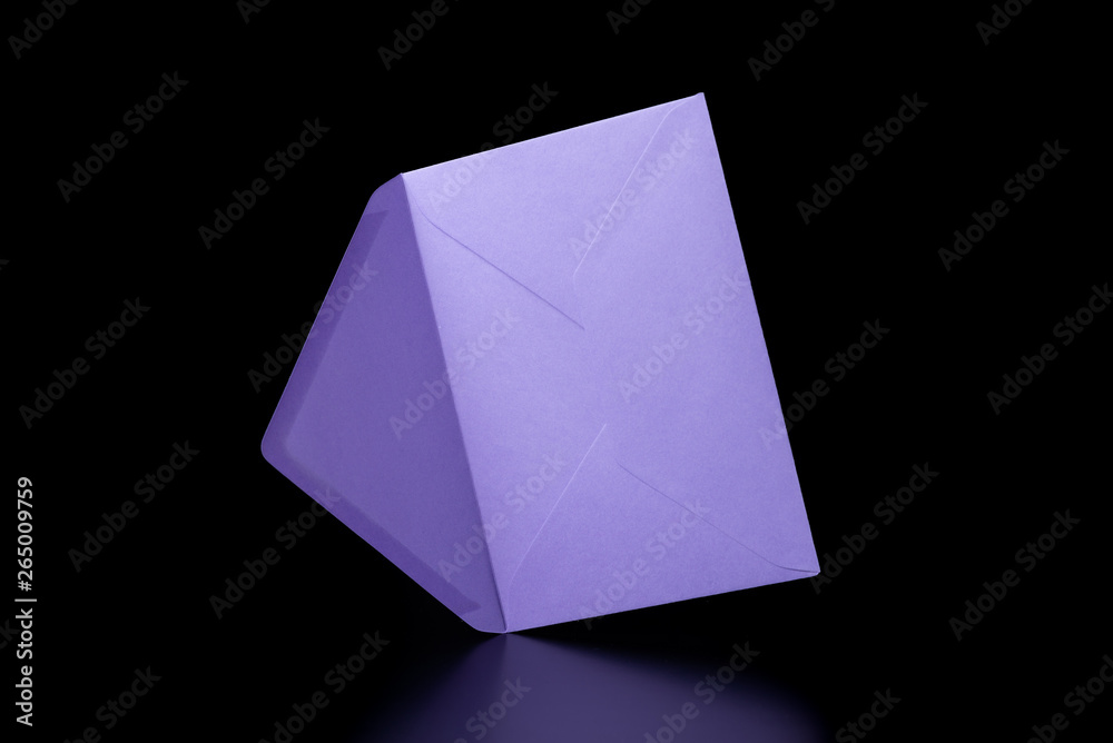 Purple envelope in the open state on a black background. The envelope is on the side. Purple envelope in the open state on a black background. The envelope is on the side.
