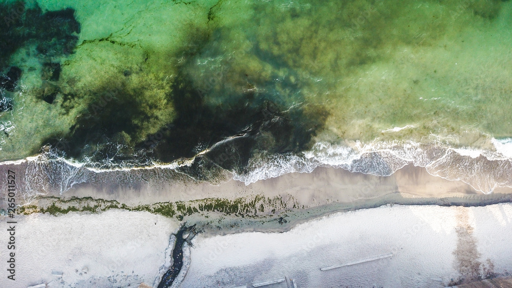Seashore photographed from the drone. The ebb and flow of the sea. Desert beaches. More green and blue colors