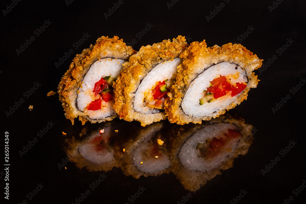 Fresh and tasty sushi on dark background. It can be used as a background Fresh and tasty sushi on dark background. It can be used as a background
