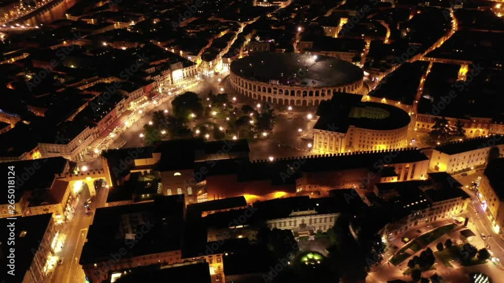 Aerial drone night video from iconic illuminated Arena theatre and City Hall in Bra square of beautiful city of Verona, Lombardy, Italy Aerial drone night video from iconic illuminated Arena theatre and City Hall in Bra square of beautiful city of Verona, Lombardy, Italy