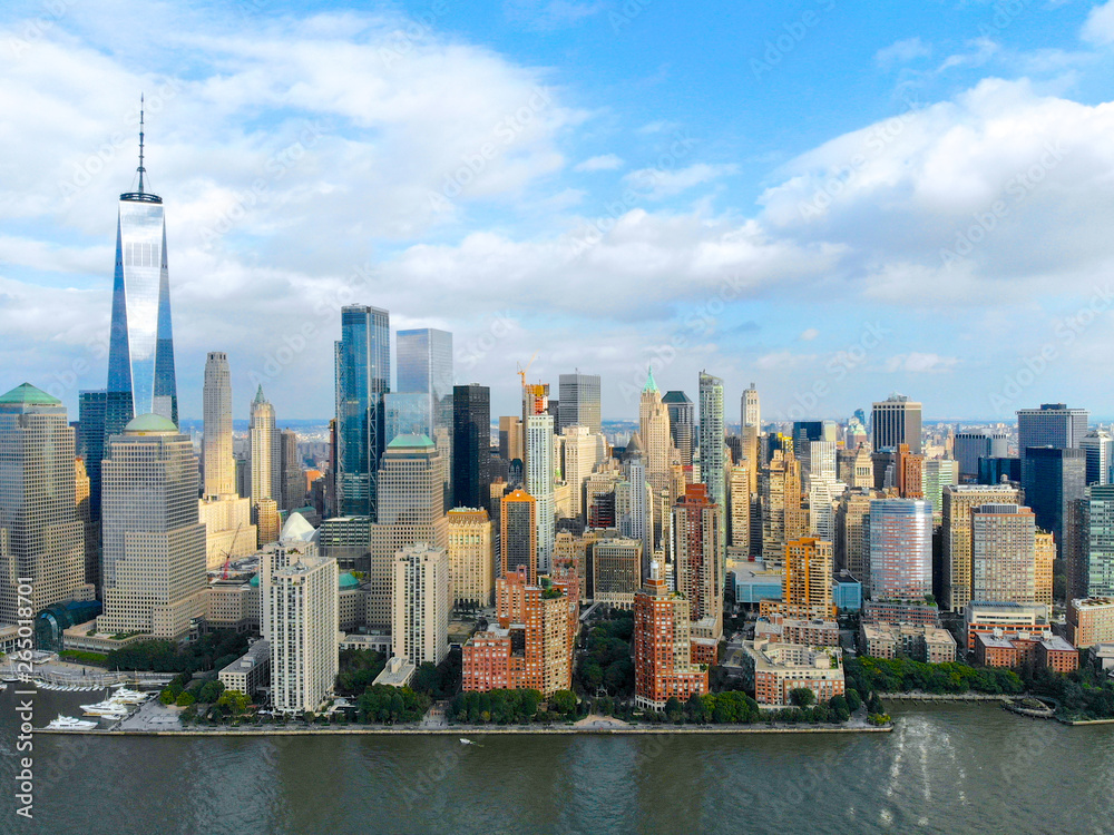 Stunning aerial view of Manhattan Skyline, with World Trade Center, New York, USA. Panoramic skyline with skyscrapers and financial district and Hudson river, New York, USA