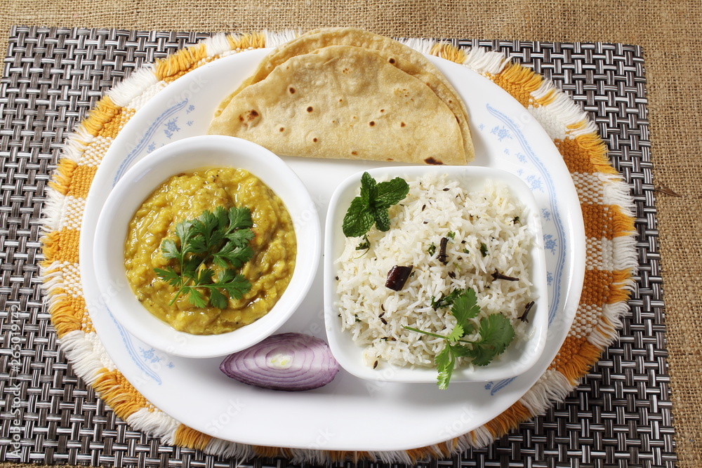traditional Indian gujarati food dish basmati jeera rice with dal fry