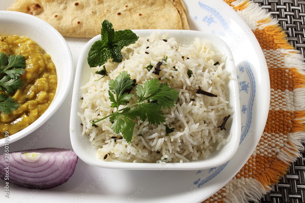 traditional Indian gujarati food dish basmati jeera rice with dal fry