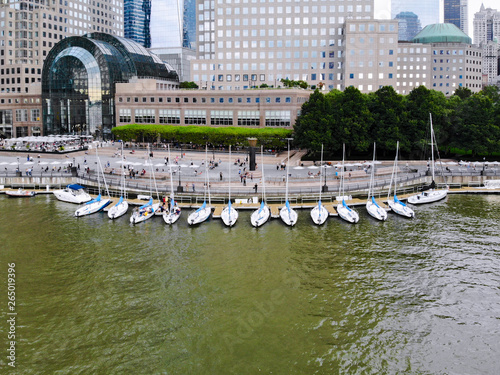 Aerial view Boats & ships docked at the North Cove Marina at Battery Park in Manhattan with Brookfield Place complex and offices buildings on the background.  photo