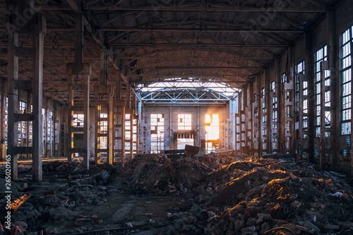 Sunlight of sunset in large abandoned industrial building