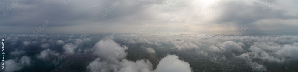 Flight over the clouds, panorama. Weather 