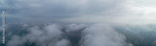 Flight over the clouds, panorama. Weather 