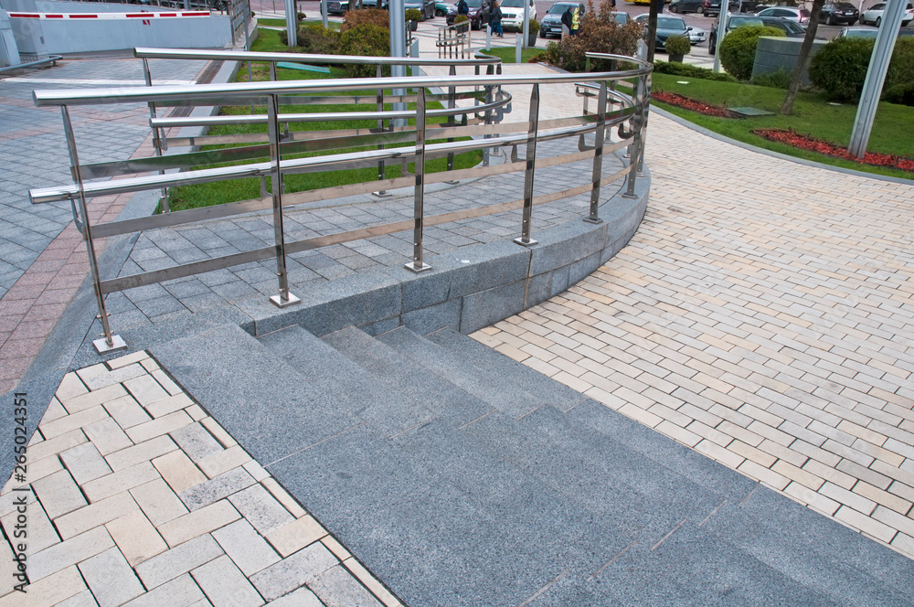 railing and pavement in recreation areas and near architectural buildings railing and pavement in recreation areas and near architectural buildings