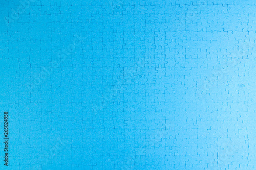mosaic monotonous structural background: blue surface built with puzzle