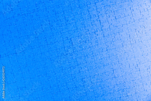 mosaic monotonous structural background: blue surface built with puzzle