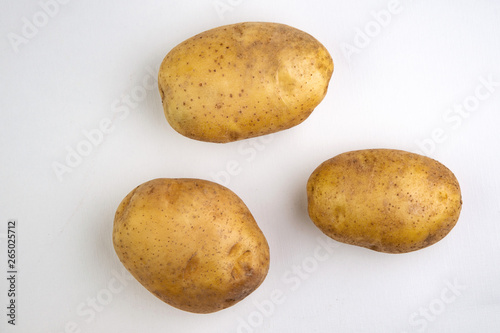 vegan diet  fresh raw organic potatoes  on white  short focus