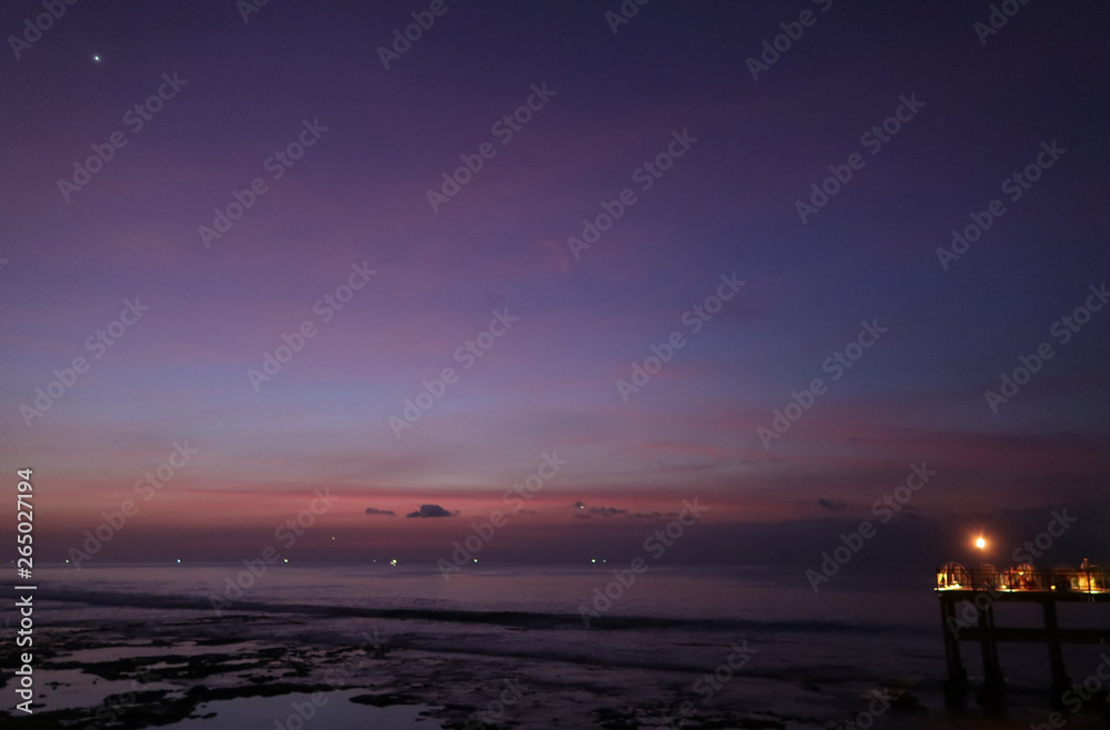 Bali beach sunset with fishing boats and bright sky Bali beach sunset with fishing boats and bright sky